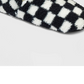 Women's Checkered Print Cozy Fleece Pull-On Slipper Socks with Grippers Black/Ivory Size S