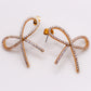Golden Bow Tie Sparkle Earrings - Elegant Accessory
