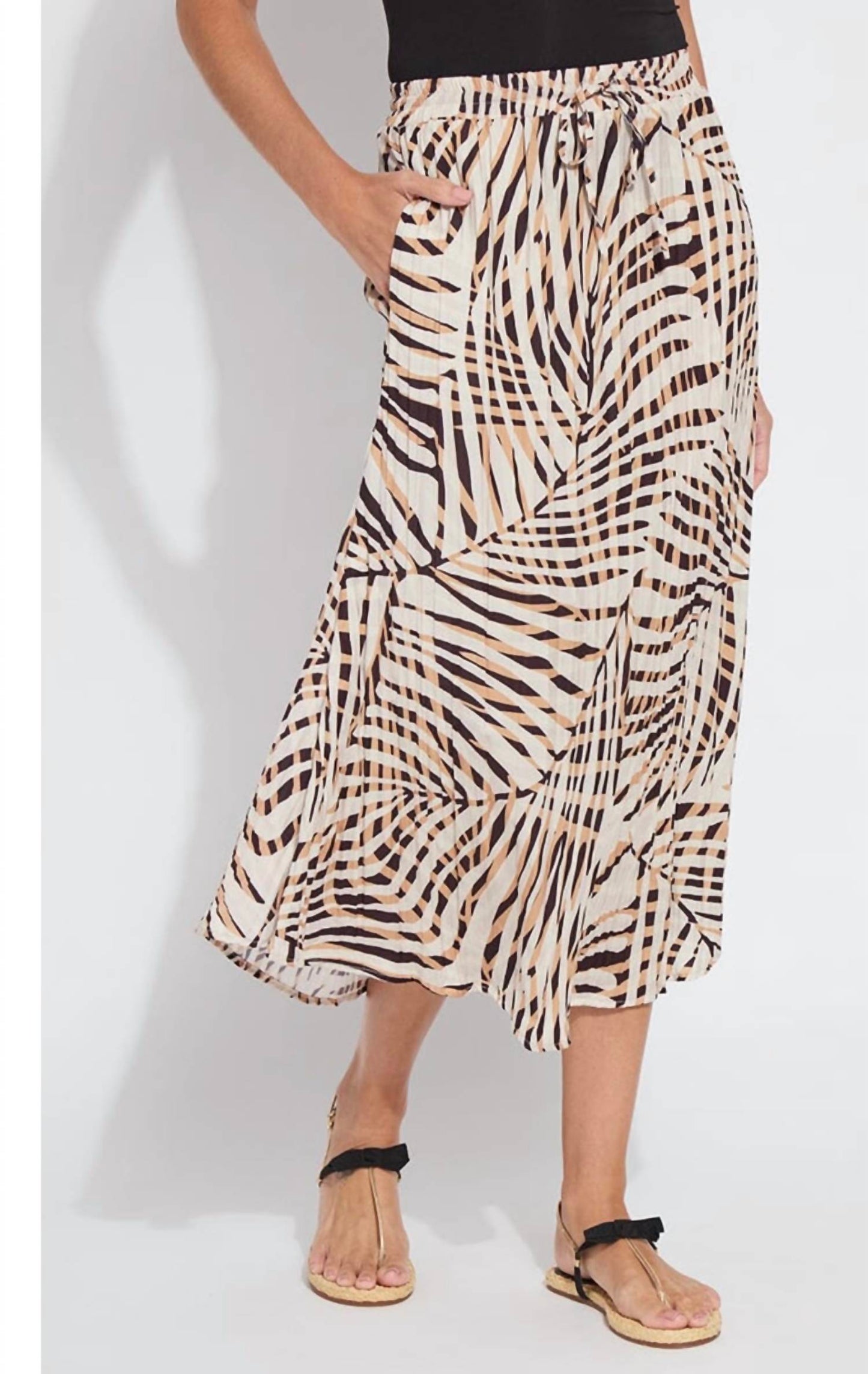 Lysse - the packable pleated skirt