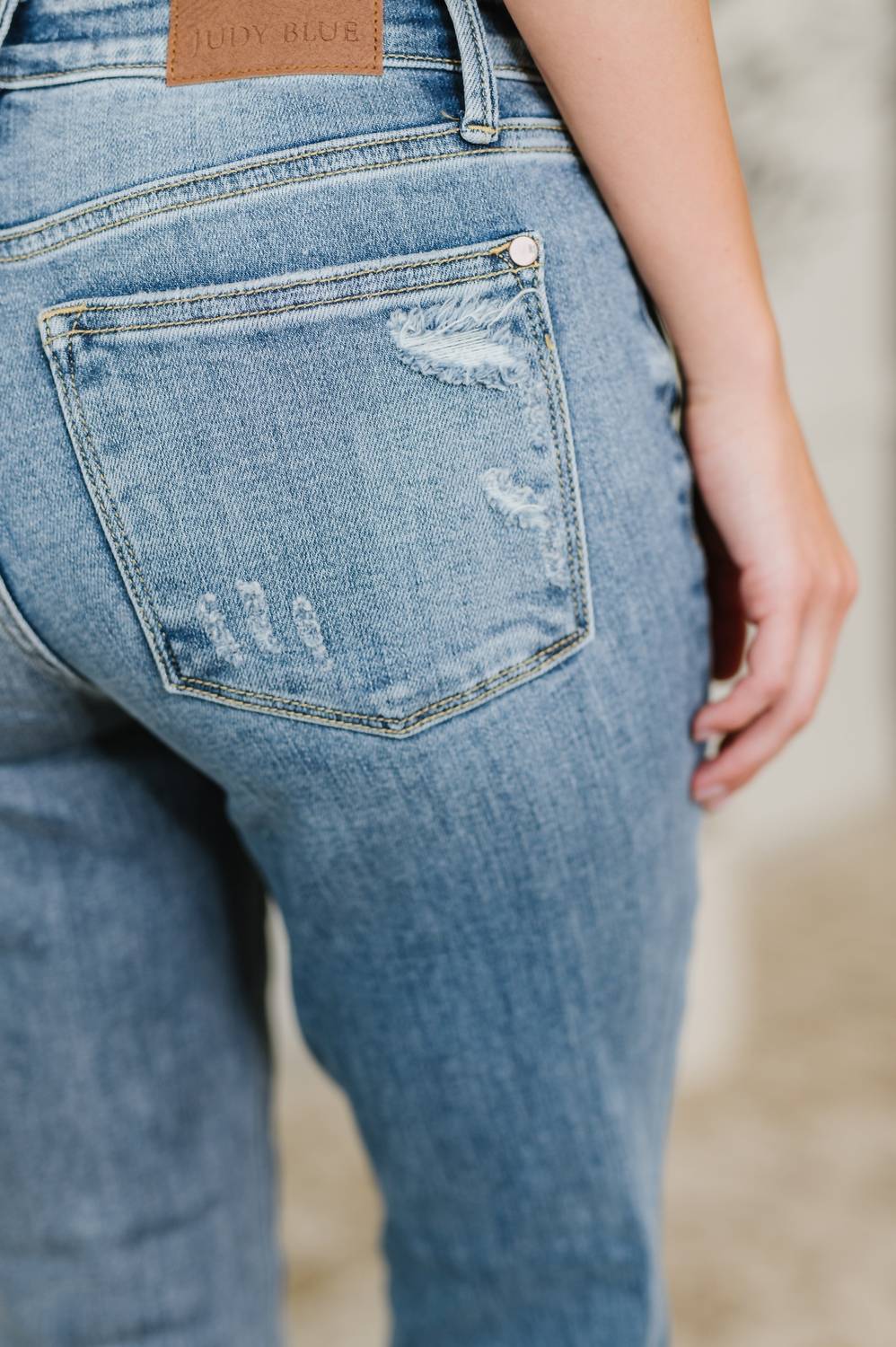 Judy Blue - Mid Rise Boot Cut Jean With Distress Hem