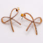 Golden Bow Tie Sparkle Earrings - Elegant Accessory